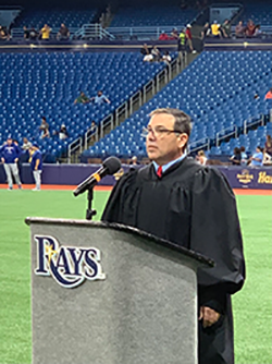 U.S. Magistrate Judge Anthony Porcelli welcomes new citizens at Tropicana Field.