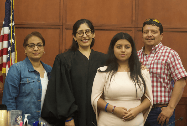 U.S. District Judge Diana Saldaña welcomes Kazen Fellow Odete Coss and her parents at the federal courthouse in Laredo, Texas.